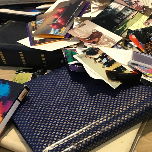 Physical Photo and Memorabilia Organizing-pile of photo albums, physical photos, negatives, photo envelopes
